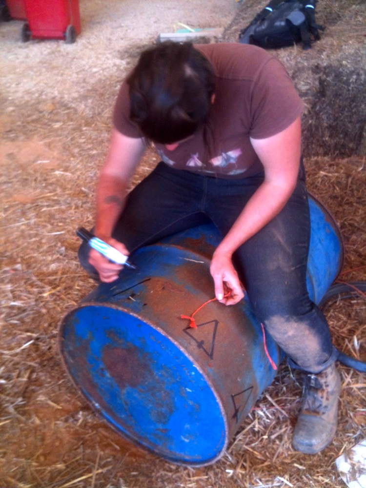 Kel marks out the triangles for the base of the outer drum