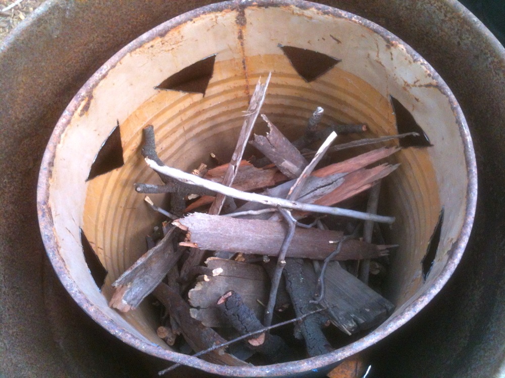 Biomass in inner drum, getting ready to burn